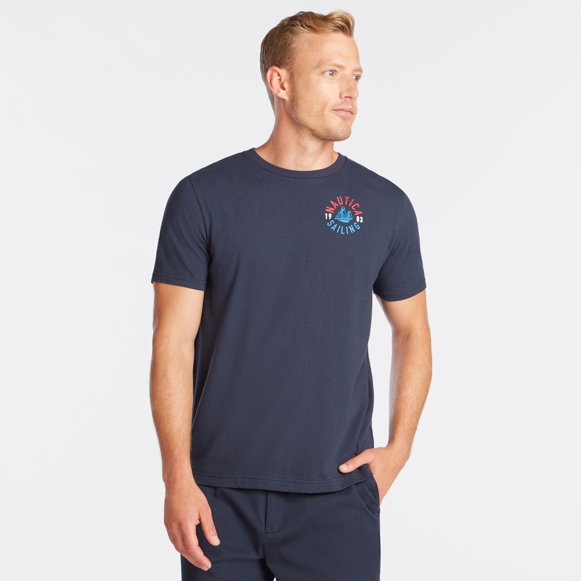 NS-83 CREST GRAPHIC T-SHIRT,Navy,large